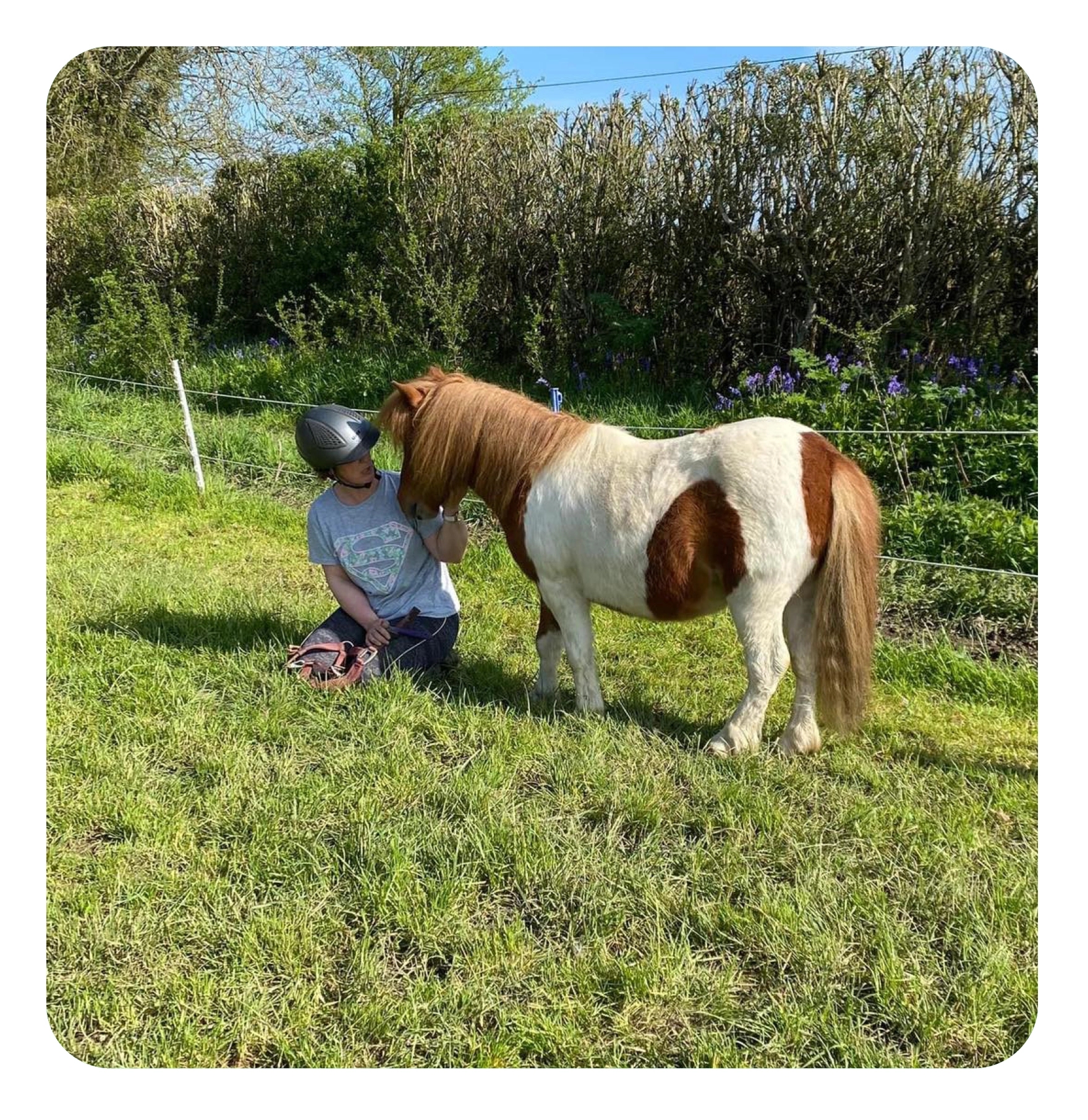 woman on a horse doing the heart sign 