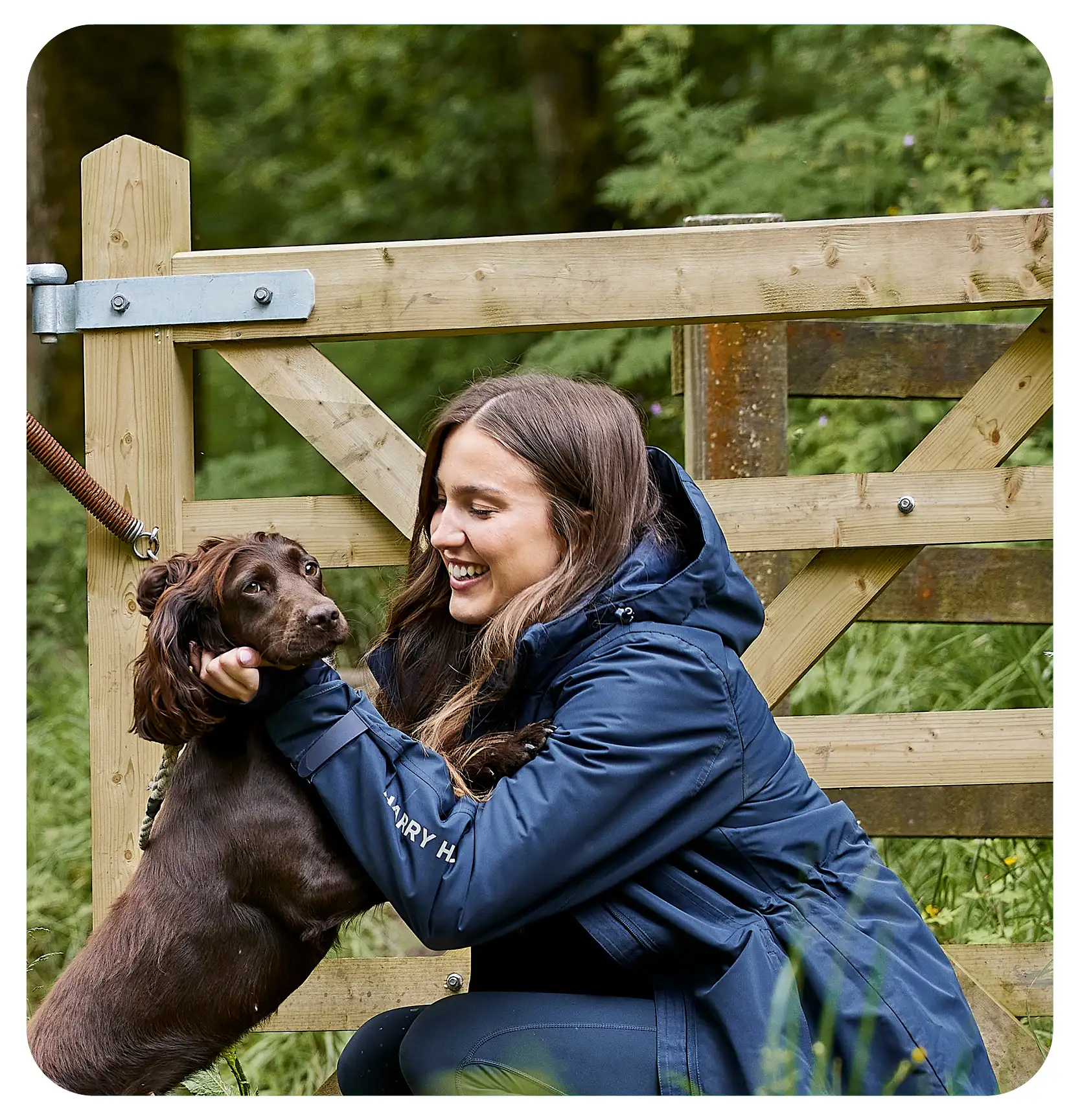 woman cuddling her dog