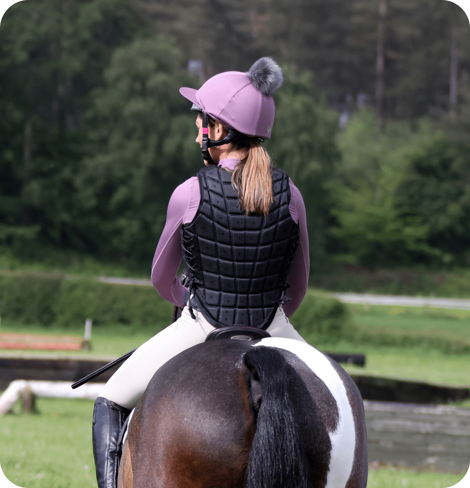 woman cuddling her brown dog
