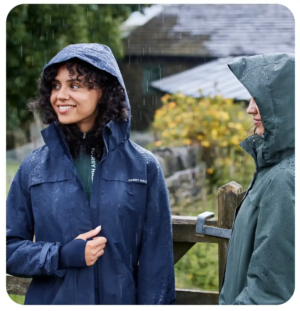 woman sitting on hay browsing on her phone